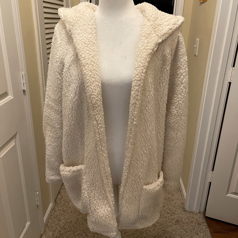 Cream colored fleece hooded teddy Jacket with pockets. Size L. Fits like a M